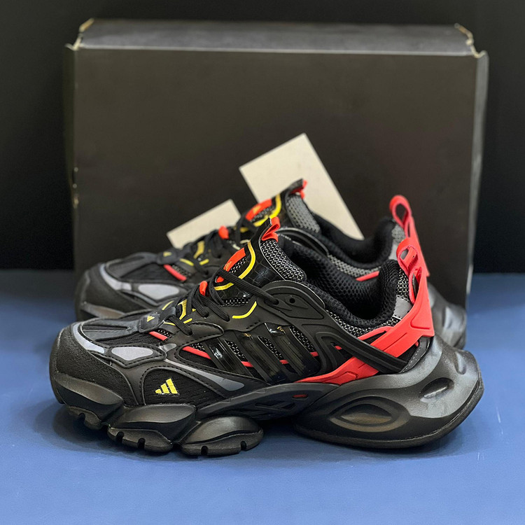 آدیداس رانر اکس ال جی دیلاکس مشکی قرمز طلایی adidas XLG Runner Deluxe Black Gold Metallic Red